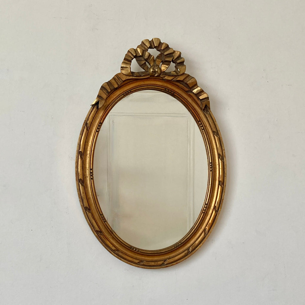 Miroir doré en bois