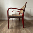 Banc vintage en bois rouge et corde