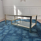 Table basse dorée à plateaux de verre