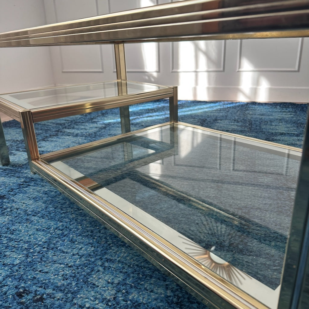 Table basse dorée à plateaux de verre