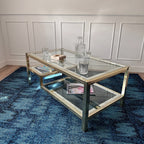 Table basse dorée à plateaux de verre
