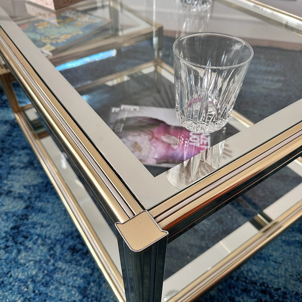 Table basse dorée à plateaux de verre