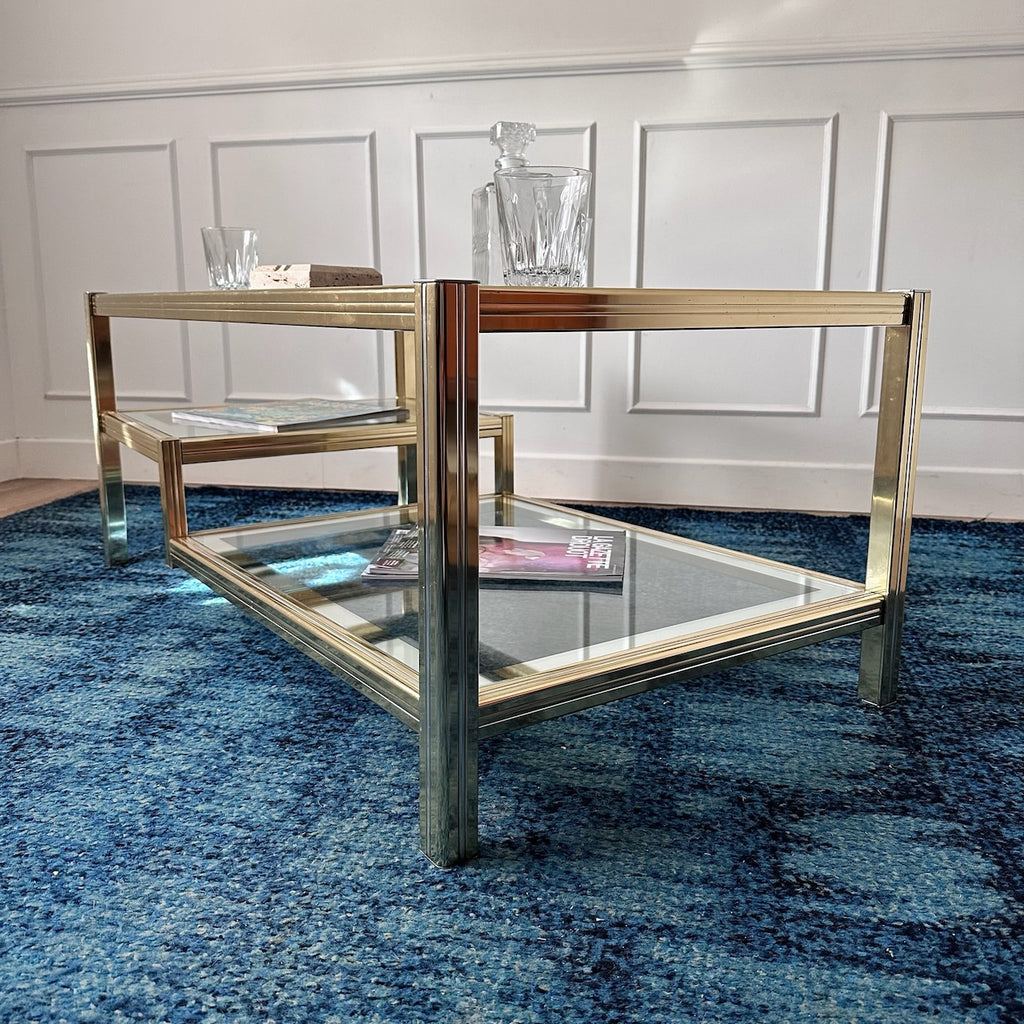 Table basse dorée à plateaux de verre