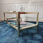 Table basse dorée à plateaux de verre