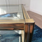 Table basse dorée à plateaux de verre